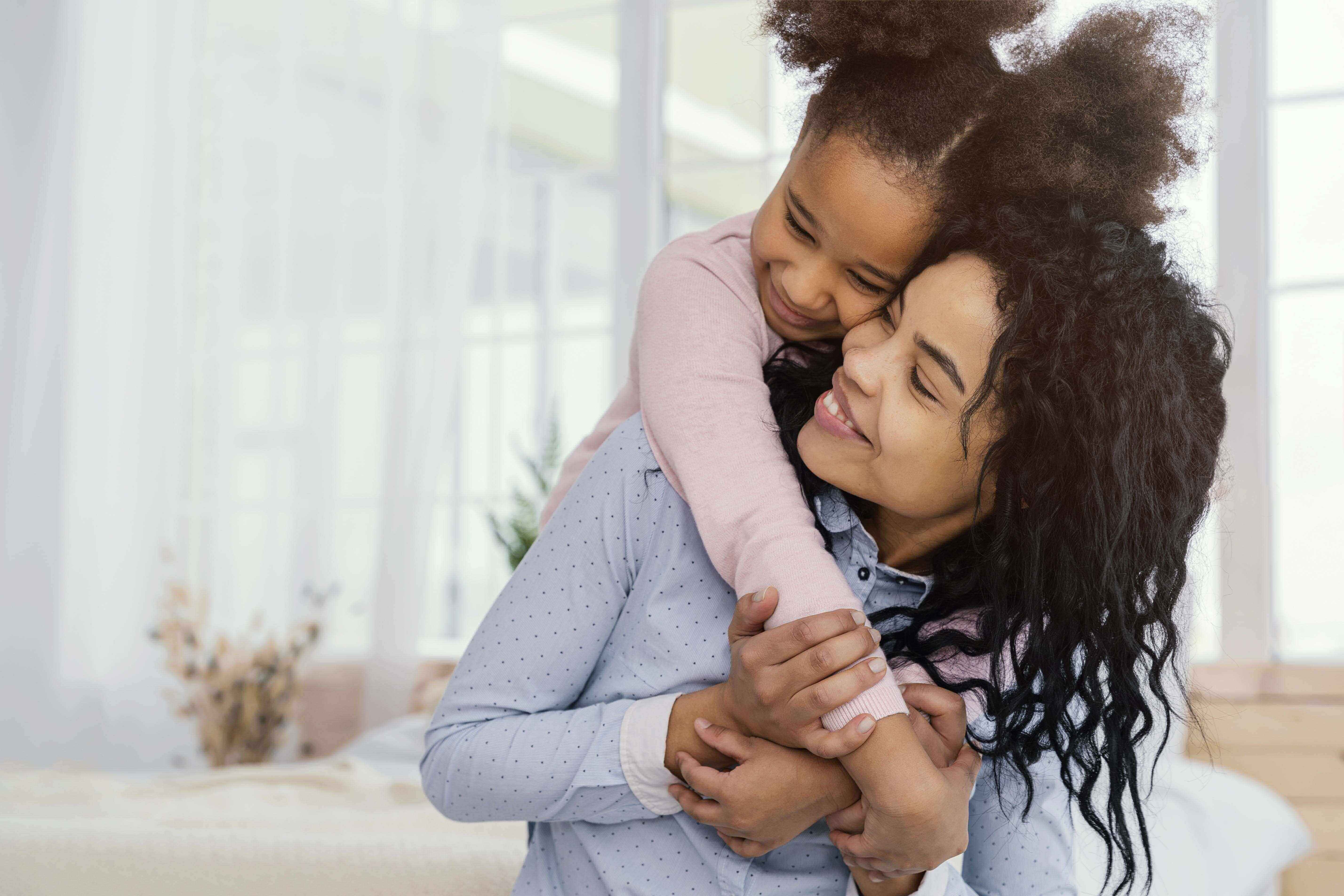 A mother and daughter playing in the house