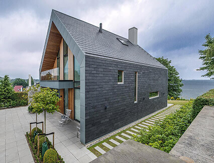 A grey timber frame house.